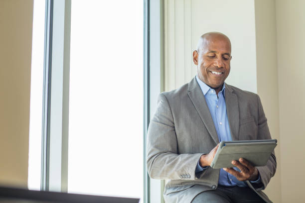 istock Mature African American man working on a tablet. 1189667666