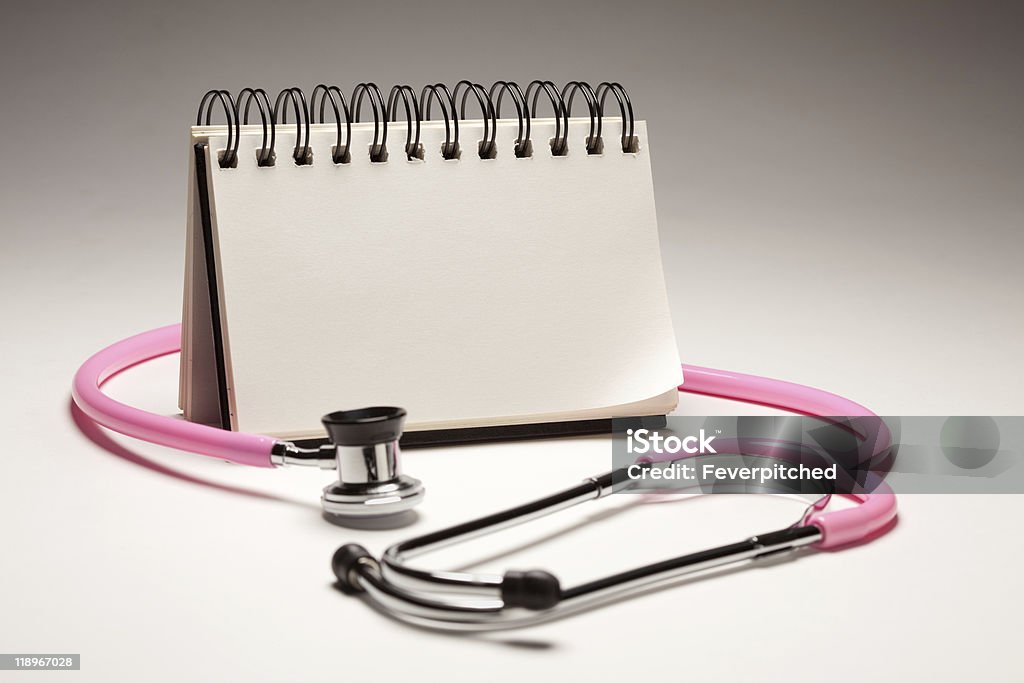 Blank Spiral Note Pad and Pink Pediatric Stethoscope  Book Stock Photo