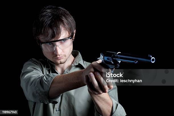 Man At Shooting Range With Revolver Stock Photo - Download Image Now - Aiming, Ear Protectors, Men
