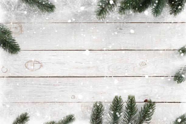 istock Pine leaves decorated as a frame on a white wooden background 1189673080
