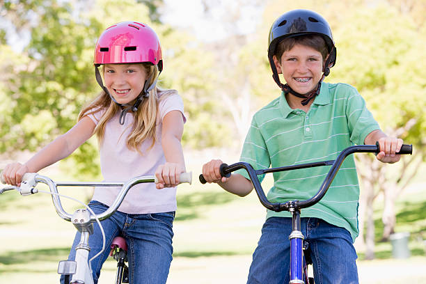 istock Brother and sister outdoors on bicycles 118967704