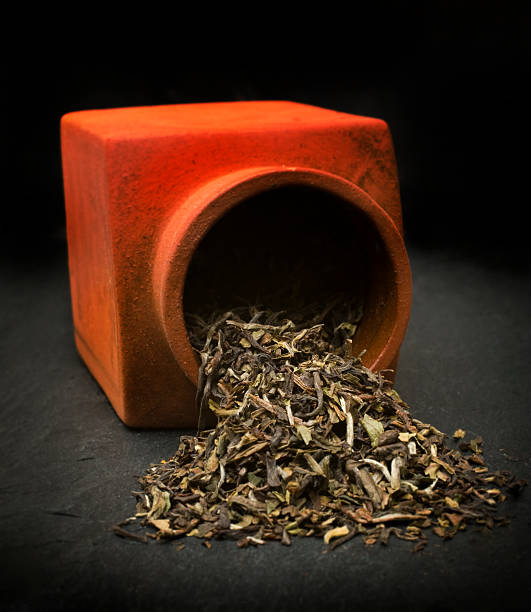 Darjeeling tea in an old stone jar stock photo