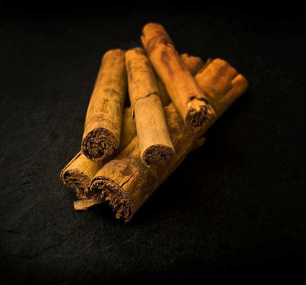 Cinnamon Sticks on Slate Worktop (SDOF) stock photo