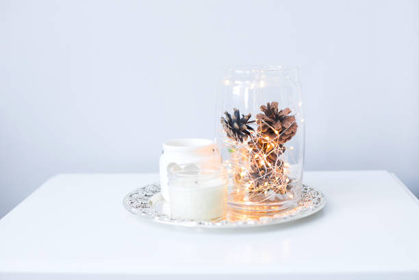 istock Christmas decor on white table. Cozy holiday interior details, soft and warm home decor. 1189682622