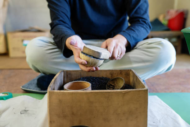 istock Man assembling fireworks by hand in preparation for a celebratory event or festival 1189684339