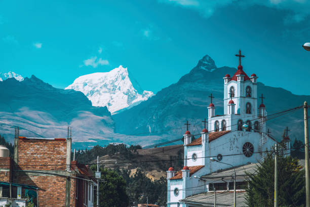 Huaraz Peru A church seen front of the Andes Mountains Cordillera Blanca in the city of Huaraz, Peru. peru photos stock pictures, royalty-free photos & images