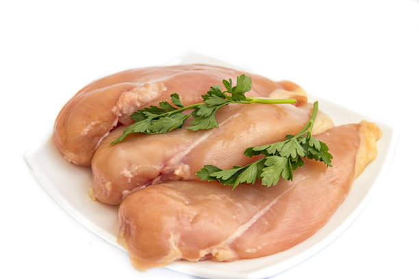 Closeup of chicken meat.Healthy chicken mini inner breast fillets .Close-up of fresh chicken inner fillet on a isolated background.
