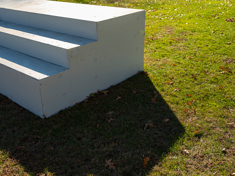 Partial view of outdoor set of white wood steps