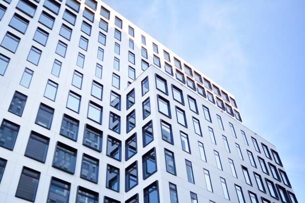 istock Modern European building. White building with many windows against the blue sky. 1189697086