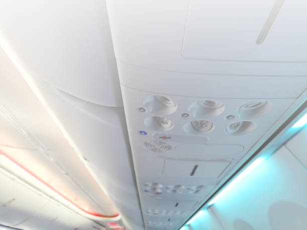 istock Information panel in the airplane, control of air conditioning and light in the cabin. Control panel above the passenger seat. Defocused image. 1189699050
