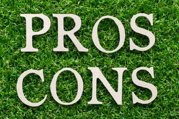 istock Wood alphabet in word pros cons on artificial green grass background 1189702514
