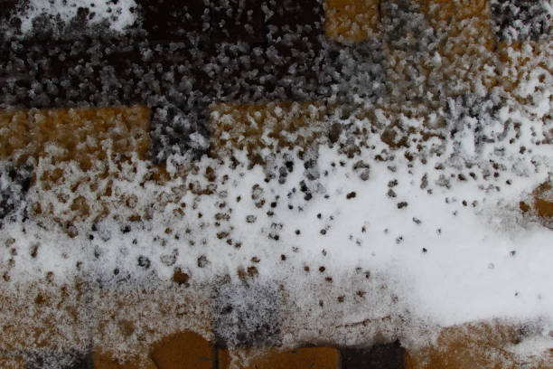 istock Wet melting snow on the sidewalk. Background 1189703790