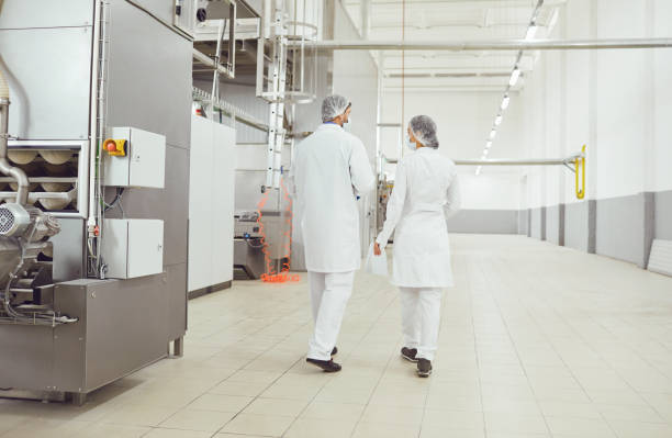 istock Technologists inspector in masks at food factory. 1189703827