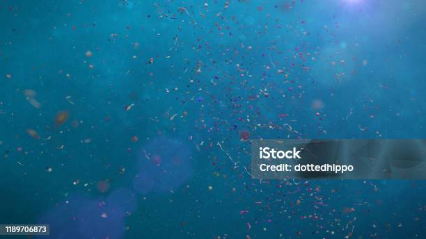 Micro Plastic Pollution Nurdles And Plastic Particle In Ocean Water Stock Photo - Download Image Now