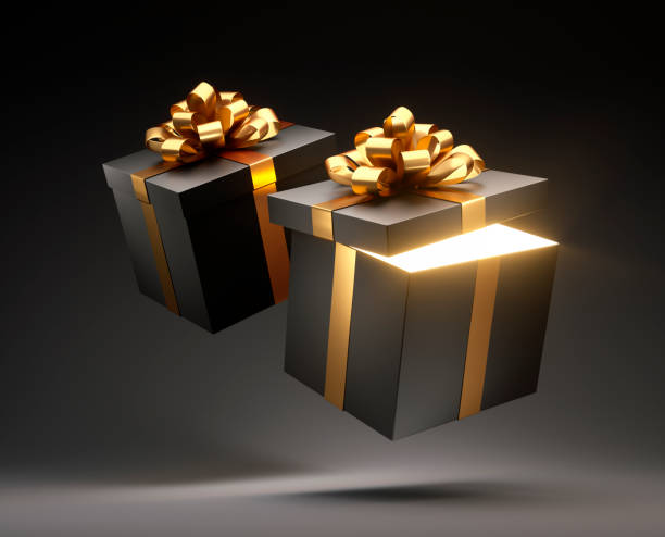 istock Two Black Gift Boxes Tied With Golden Ribbon 1189707966