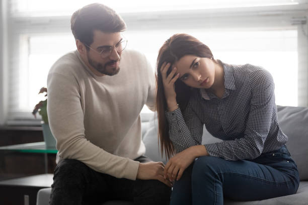istock Young husband make peace with unhappy offended wife 1189709647