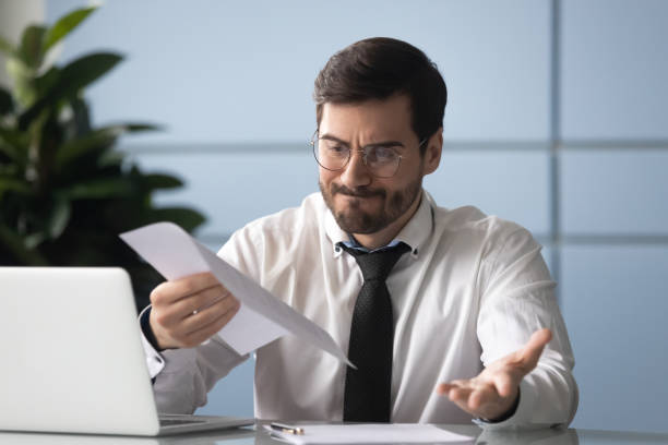 istock Mad male employee feel disappointed with company documents 1189709677