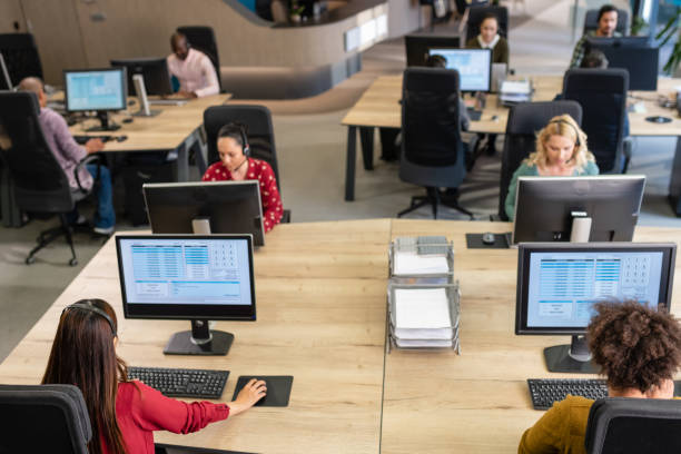istock Call Center Employees Working In An Office 1189711069