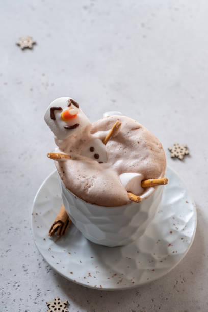 istock Hot chocolate with melted marshmallow snowman 1189712573