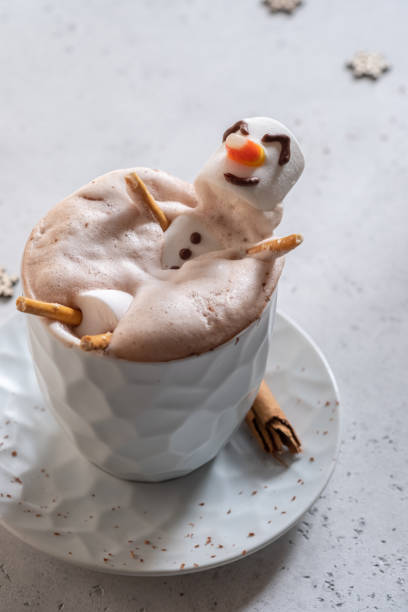 istock Hot chocolate with melted marshmallow snowman 1189712658