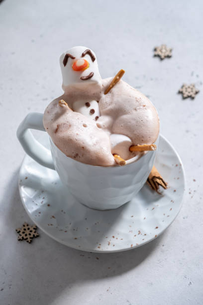 istock Hot chocolate with melted marshmallow snowman 1189713173