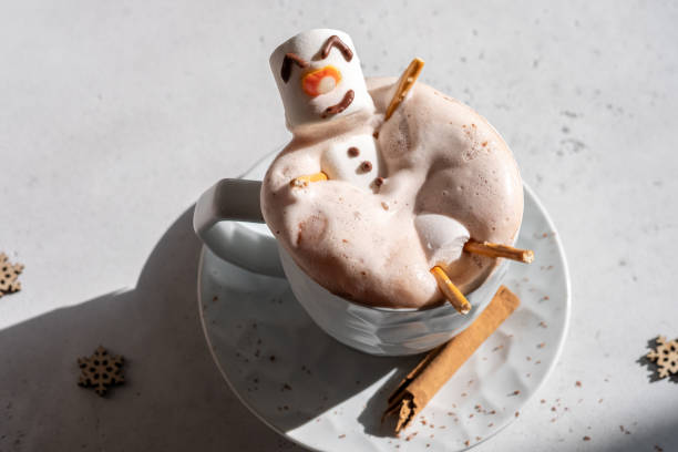 istock Hot chocolate with melted marshmallow snowman 1189713195