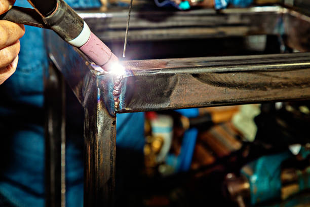 Female TIG welder Female TIG welder welding steel tungsten metal stock pictures, royalty-free photos & images