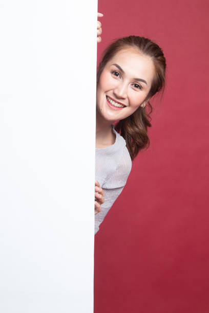 istock Young Asian woman with blank sign. 1189721400