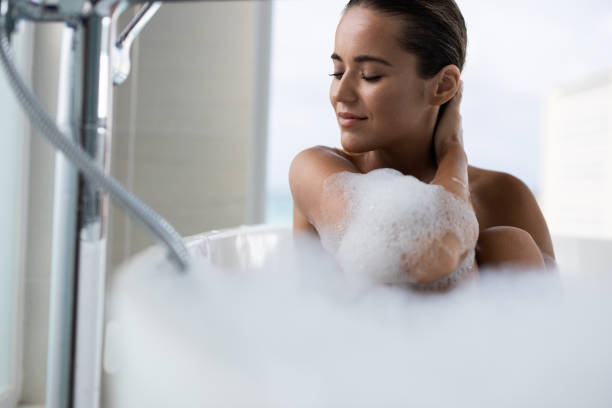 istock Beautiful woman enjoying in her bubble bath. 1189722429