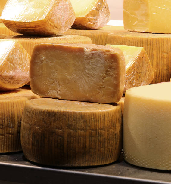 dairy shop with many cheese called Pecorino in Italian language dairy shop with many cheese called Pecorino in Italian language made with milk of sheep pecorino romano stock pictures, royalty-free photos & images