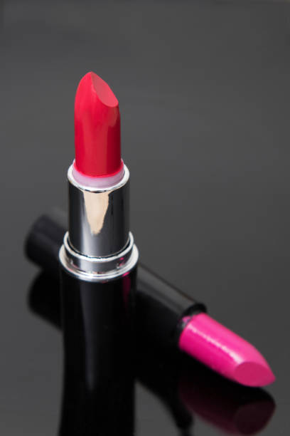 istock red lipstick or lipstick on black background 1189723493