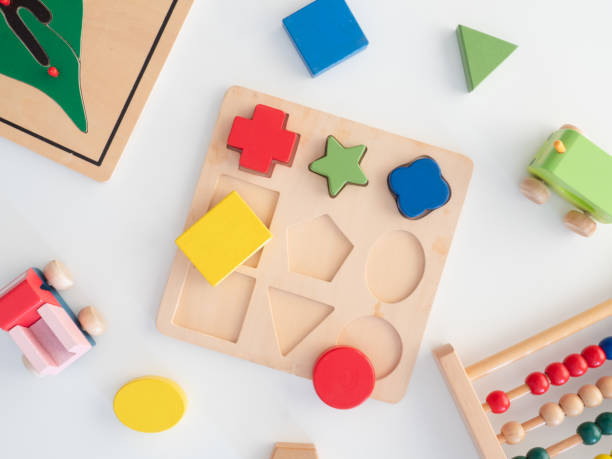 istock kids learning concept with stacking toys on white table background. 1189726979