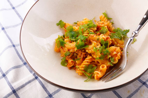 istock traditional pasta with meat and herbs in a beige plate 1189730156