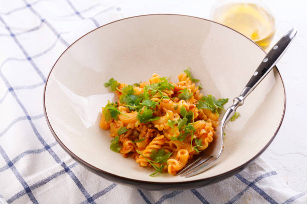 istock traditional pasta with meat and herbs in a beige plate 1189730166