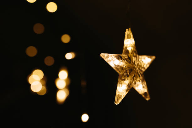 istock Christmas lights on dark background. Star shaped. 1189731233