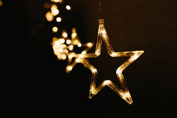 istock Christmas lights on dark background. Star shaped. 1189731271