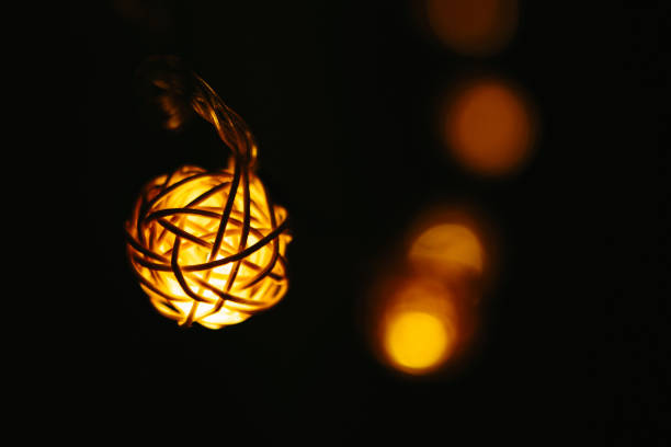 Christmas lights on dark background. Ball shaped.