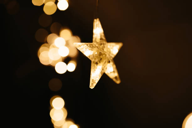 istock Christmas lights on dark background. Star shaped. 1189731401