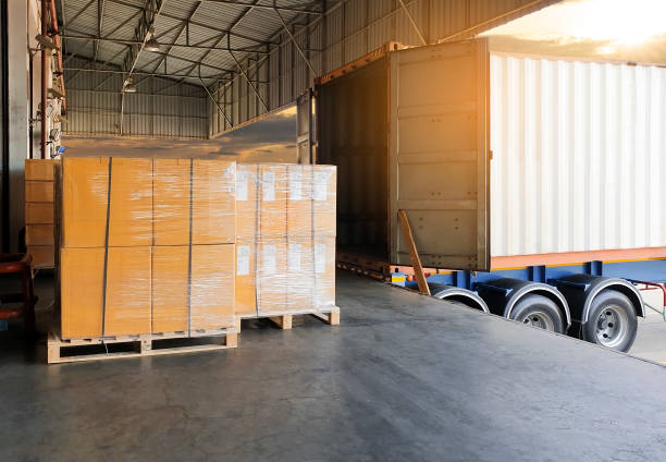 istock Warehouse business, freight industry, cargo shipment transport, goods pallets load shipment delivery with a truck container. 1189731642