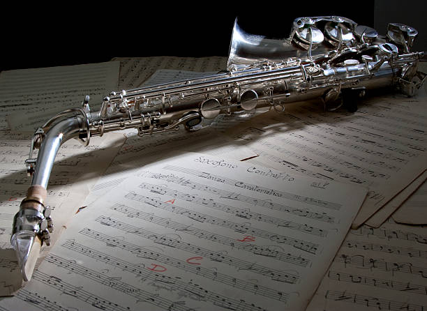 istock Saxophone cigarette and old sheet music 118973363