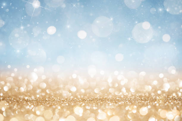 Abstract defocused gold and blue glitter background Abstract defocused gold and blue glitter background with copy space christmas card photos stock pictures, royalty-free photos & images