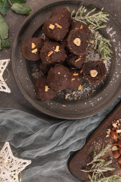 istock Dark chocolate truffles with hazelnuts on plate. Top view. Flat lay 1189735218