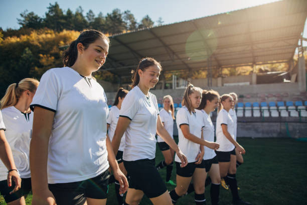 istock Female soccer players exercising at stadium 1189735233