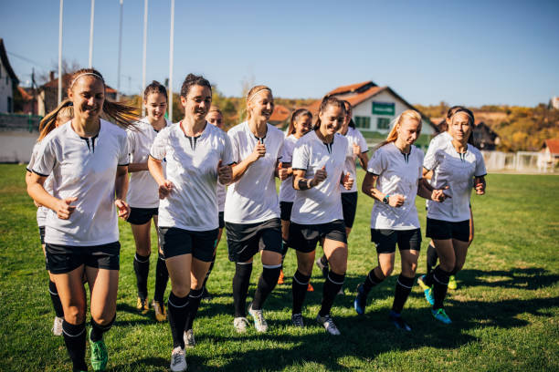 istock Female soccer players exercising at stadium 1189735459
