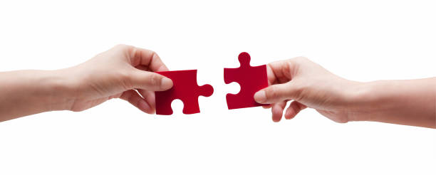 istock (clipping path) Two Puzzle Pieces Coming Together isolated on white background 1189735491