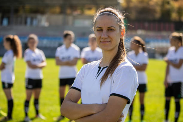 istock Female soccer players huddling 1189735578
