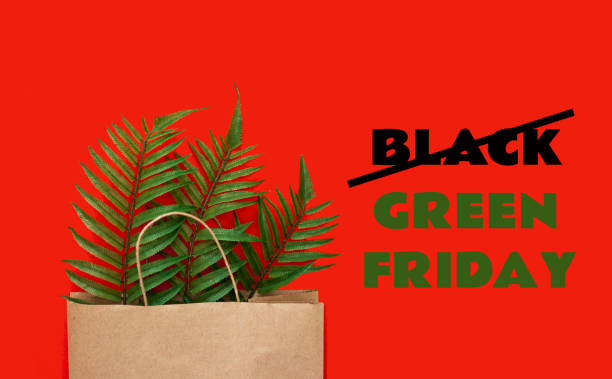 Slogan Black Green Friday. Concept of zero waste, ecology, overproduction and environmental issues Slogan Black Green Friday. Concept of zero waste, ecology, overproduction and environmental issues. Paper bag with fern leaves. strike protest action photos stock pictures, royalty-free photos & images
