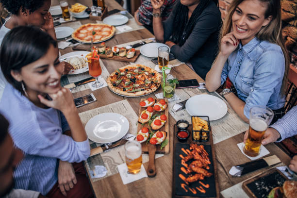 istock Friends enjoying in pub 1189739229