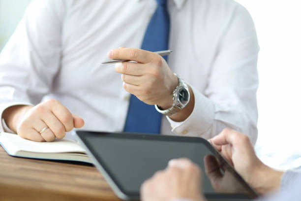 istock Business team meeting to discuss statistical data presented in the form of digital graphs and charts 1189739528