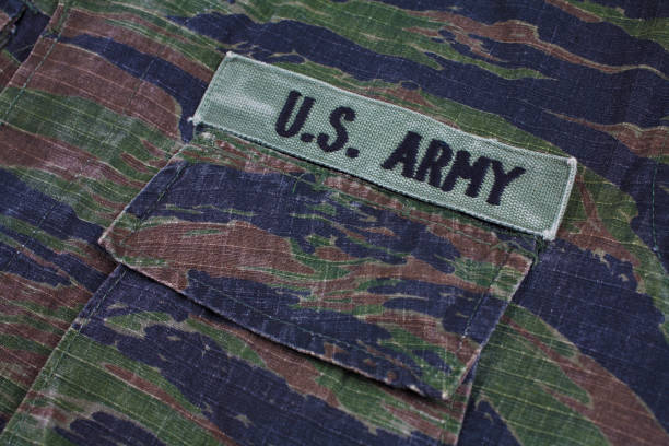 istock US ARMY branch tape on tiger stripe camouflage uniform 1189744523